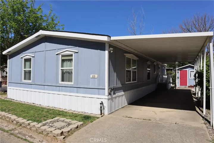 Carport and entrance to laundry and kitchen
