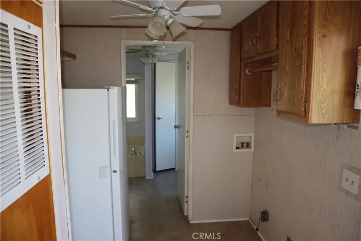 Large Laundry Room with Freezer and storage