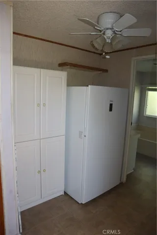 Large Laundry Room with Freezer and storage