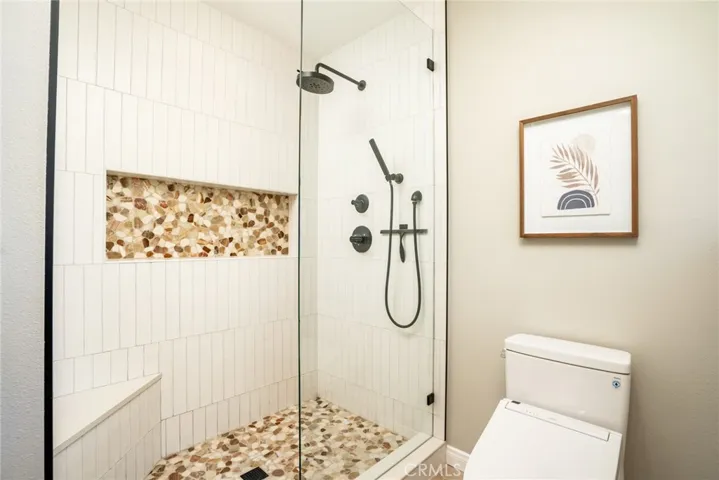 Primary walk-in shower w/seating bench!