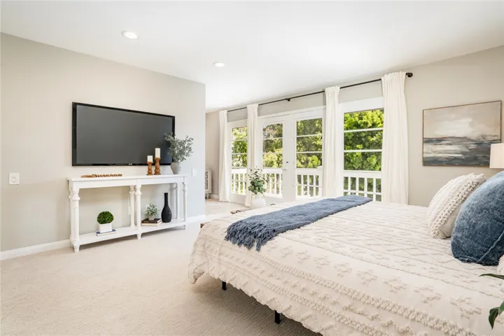 Primary suite w/private deck overlooking the backyard!