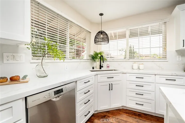 Corner sink w/amazing windows and tons of drawers!