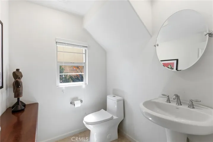 Convenient main-level powder room with a clean, minimalist design and natural light.