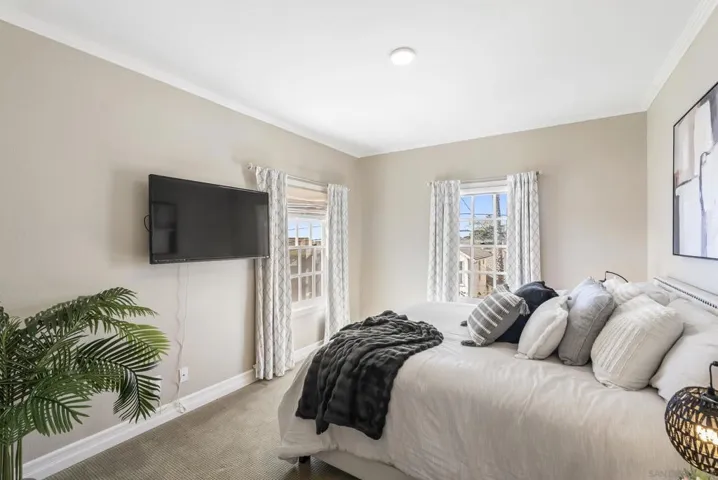 A light-filled third bedroom, where soft tones, natural light, and a peaceful ambiance create a comfortable space for rest, guests, or flexible living.