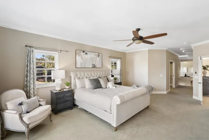 A serene and expansive primary suite, where soft light, generous proportions, and a private sense of separation create a calming retreat with space to unwind and recharge.