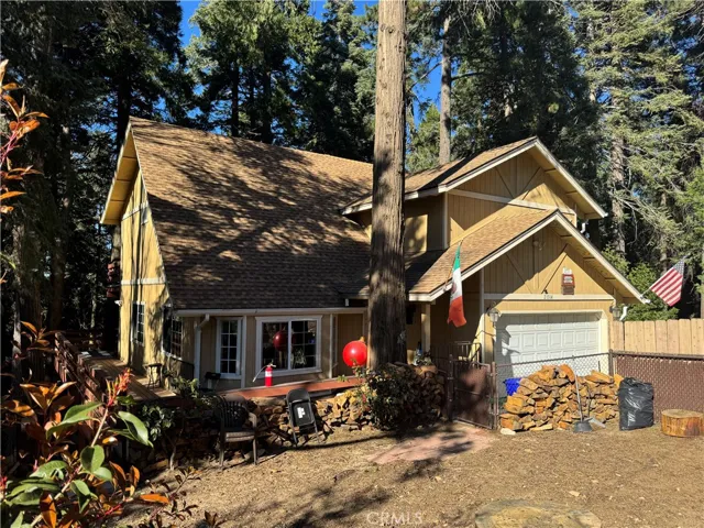 Front view of home with a good size flat front yard