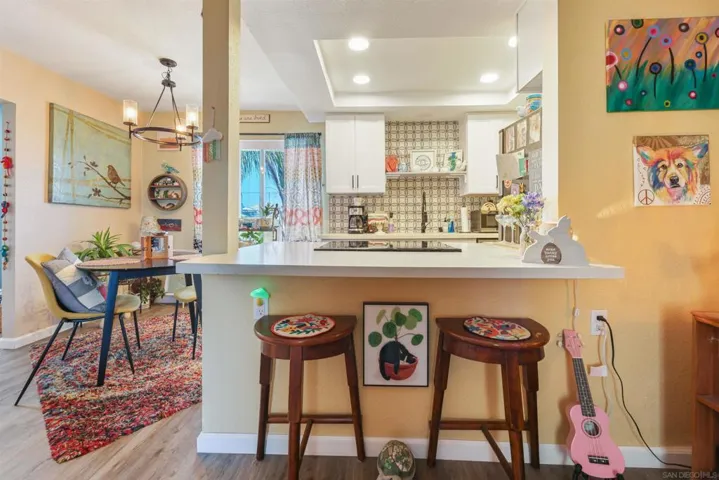 Fully remodelled open concept kitchen wiith breakfast bar.