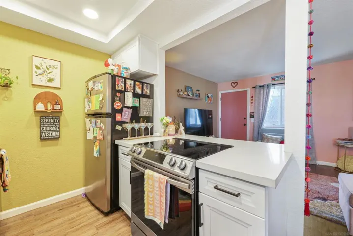 Flat top electric cooking.  Refrigerator conveys