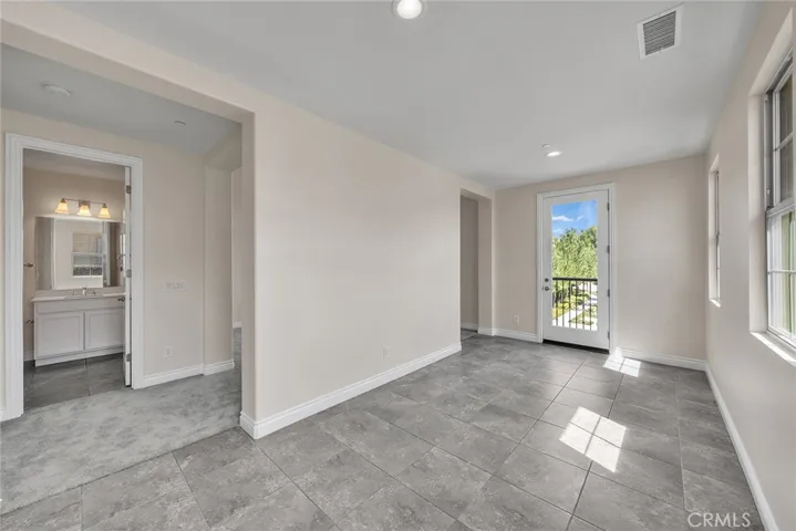secondary suite includes a covered space just off the bedroom, creating a seamless indoor-outdoor extension ideal for relaxation or flexible use