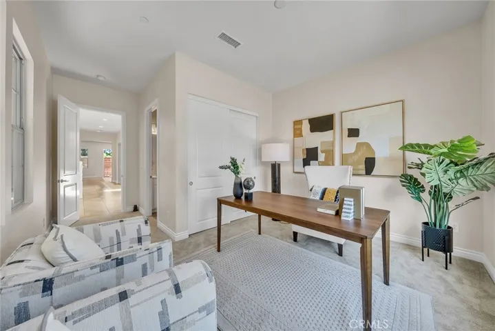 Ground Level Bedroom With Ensuite Bathroom. It's decorated as an office in the picture.