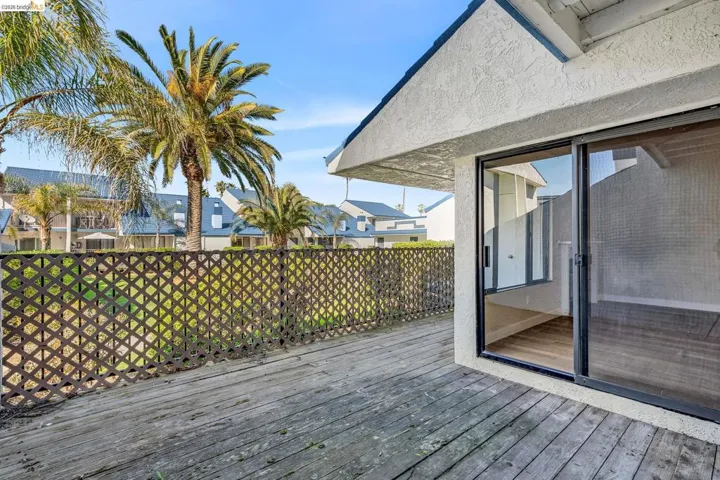 Wooden terrace featuring a residential view