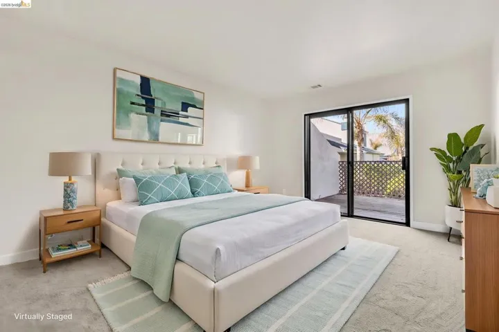 Bedroom featuring access to outside and light carpet