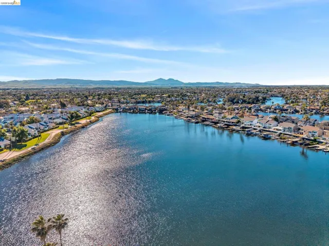 Aerial view of residential area featuring a water and mountain view