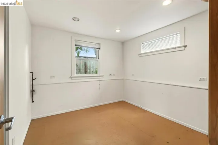Unfurnished room featuring baseboards and recessed lighting