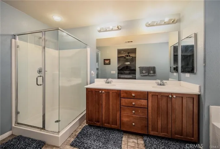 Master walk-in Shower Bathroom and sinks.