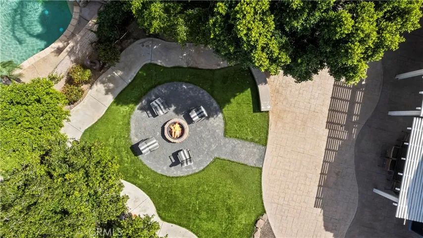 Great arial view of the firepit and artificial turf.