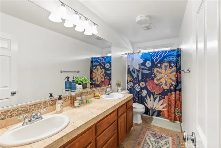 Upstairs Hall Bathroom with double sinks.