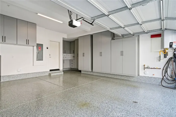 2 Car Garage with Epoxy Flooring and Built-in Cabinets