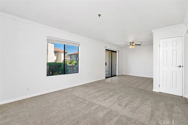 a different angle of the family room and kitchenette.