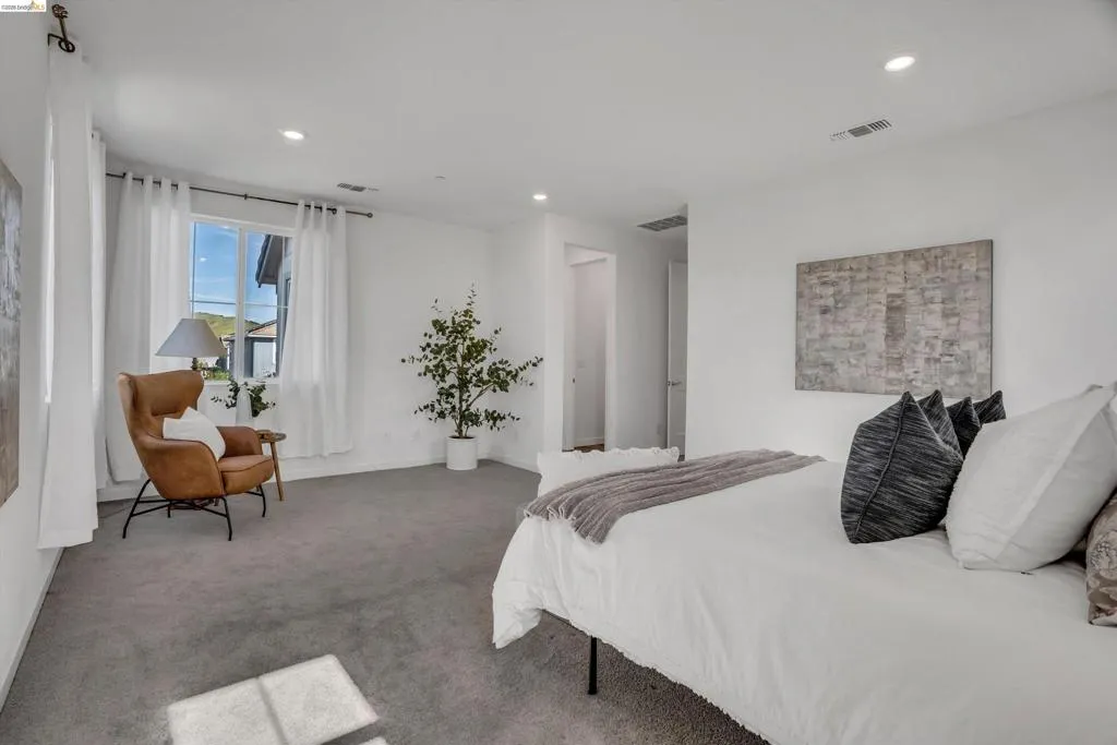 Carpeted bedroom featuring baseboards and recessed lighting