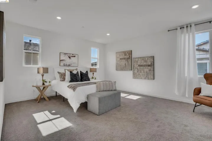 Bedroom featuring recessed lighting and light carpet