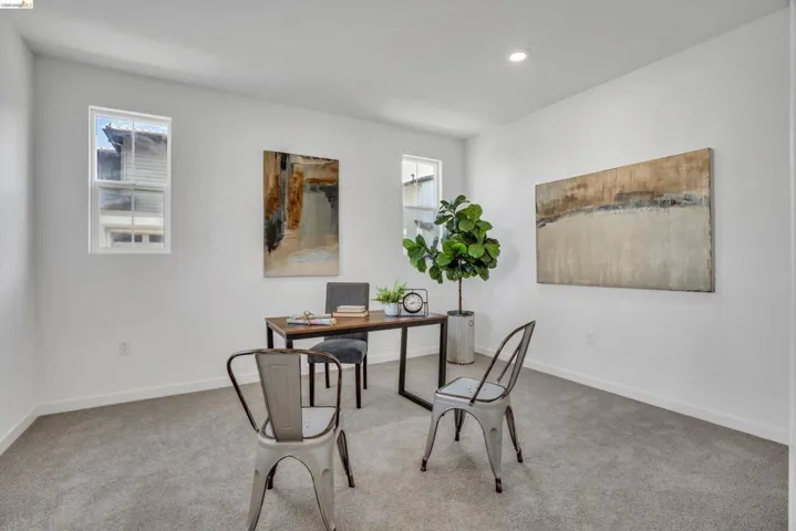 Carpeted home office with baseboards