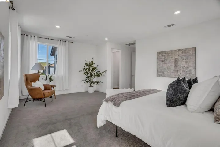 Carpeted bedroom featuring baseboards and recessed lighting