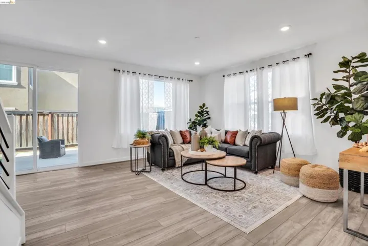 Living area featuring light wood-type flooring and recessed lighting