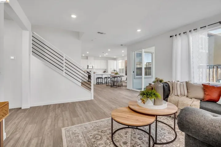 Living room featuring light wood-style floors and recessed lighting