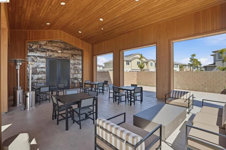 View of patio / terrace featuring an outdoor living / dining area, a residential view, and french doors