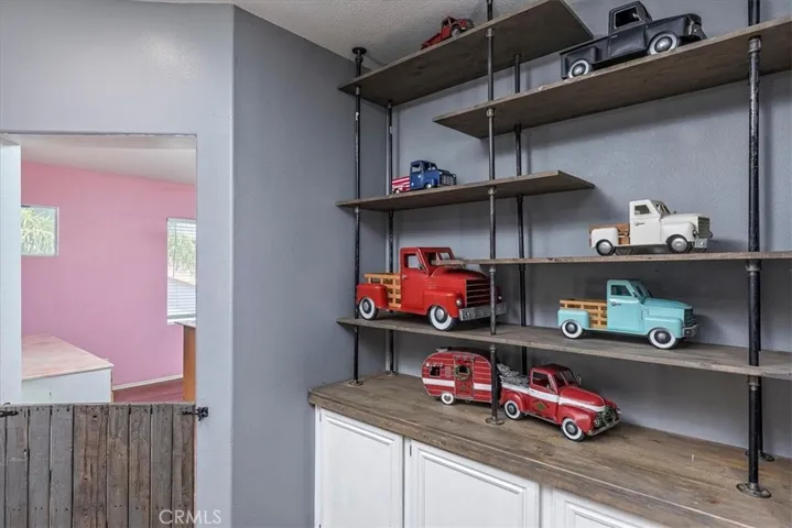 Upstairs hallway storage and shelving.