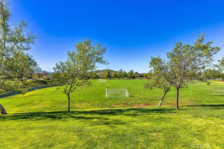 Enjoy the family playing soccer on the other side of the street.  Walking trails on far side of the park.