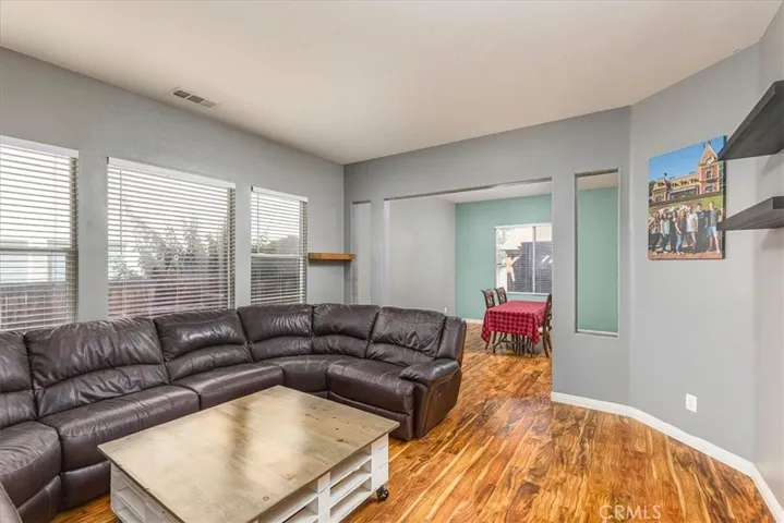 Front Living room with adjoining dining area.