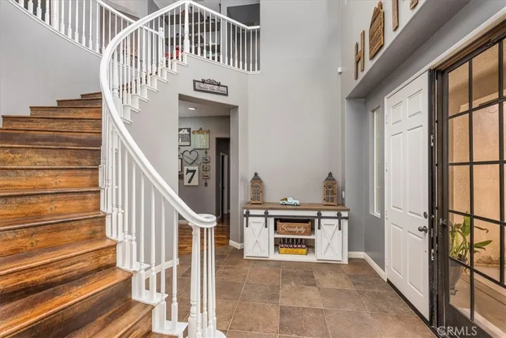 Dramatic stairway off of front entry.