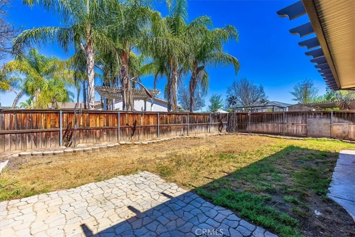 Spacious pool sized back yard ready for your special touch!