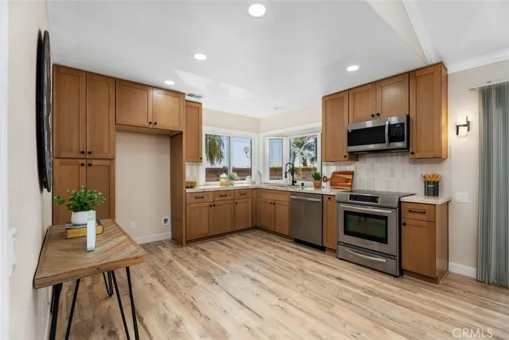 Remodeled kitchen with beautiful white oak cabinetry.