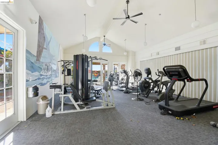 Exercise room featuring a ceiling fan