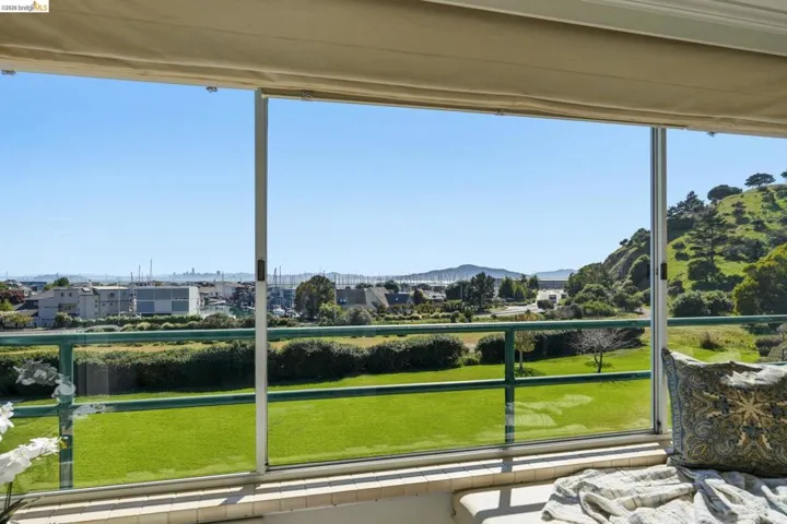 Sunroom featuring healthy amount of natural light and a mountain view