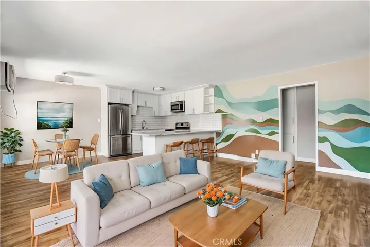 Living, dining, and kitchen. (Virtually enhanced).