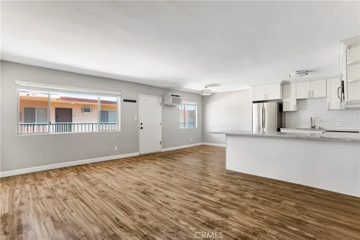 Living, dining, and kitchen.
