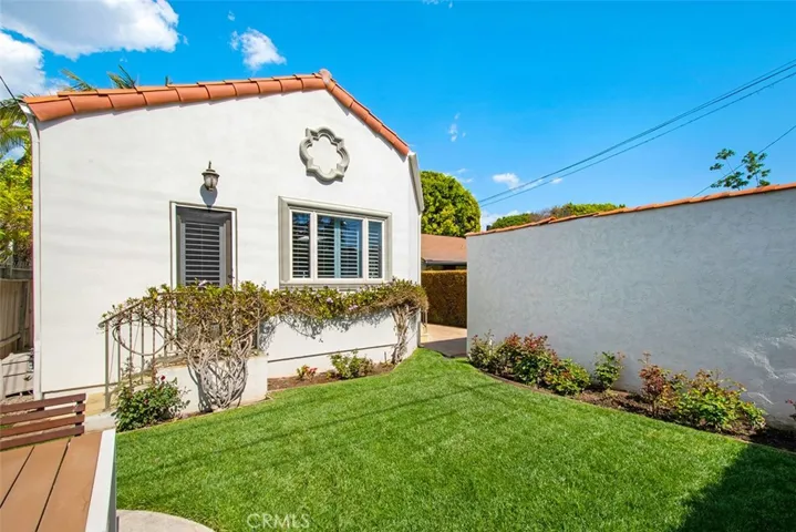 Backyard area with large grassy area.