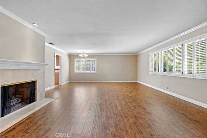 Living room with fireplace and dining area