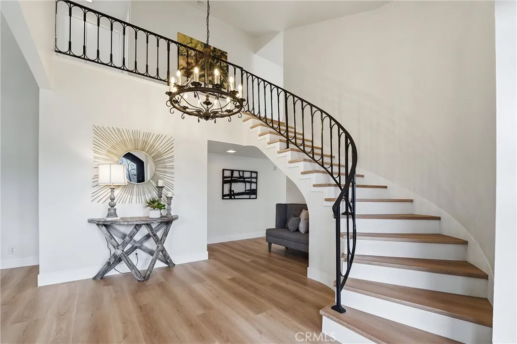 Foyer and Staircase to upper level. All flooring is brand new.