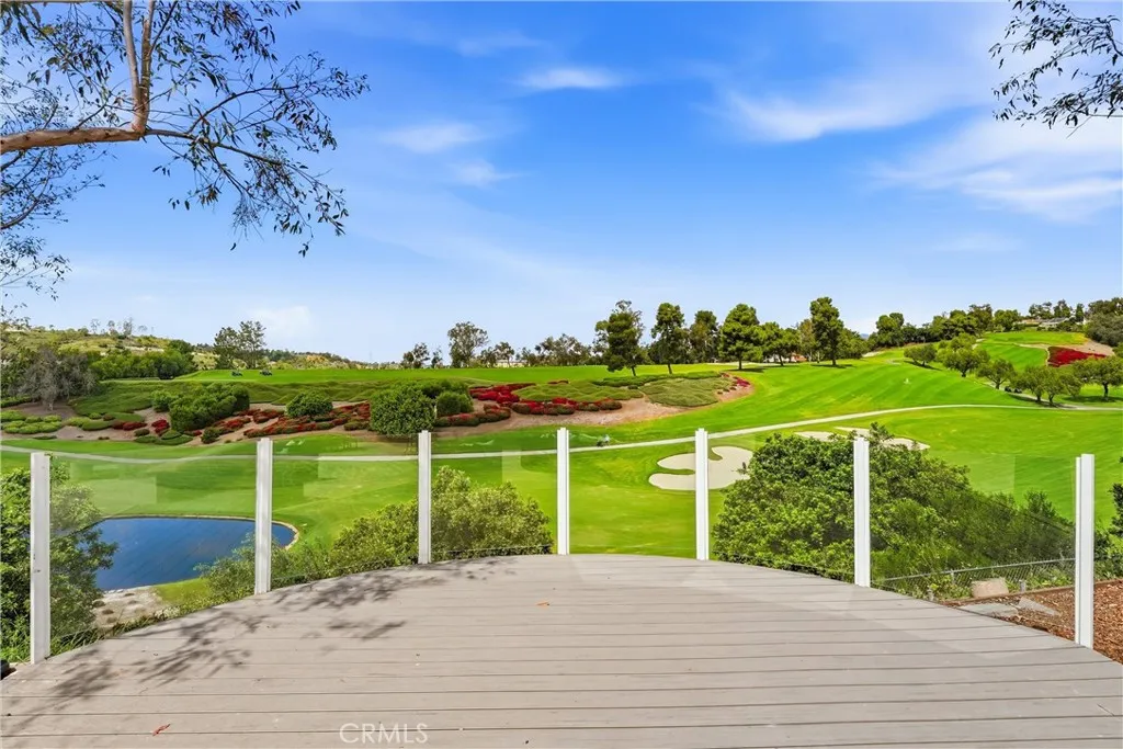 Backyard deck and its view. Full Fairway view and partial water view.