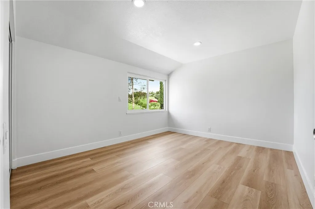 3rd Bedroom with new flooring, recessed lights, new closet doors and gorgeous view of the golf cours.