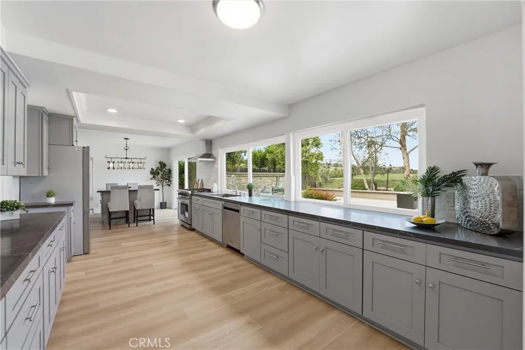 Kitchen Opens to Dining Island from one end and the family room from the other. Look at the view?