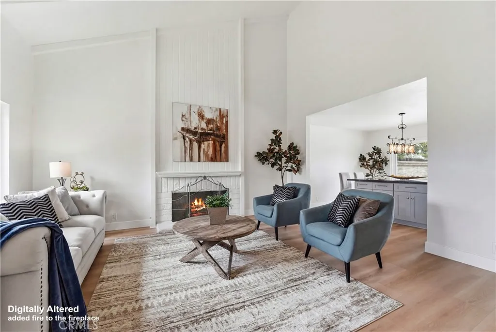 Spacious Living Room with high ceilings and fireplace.