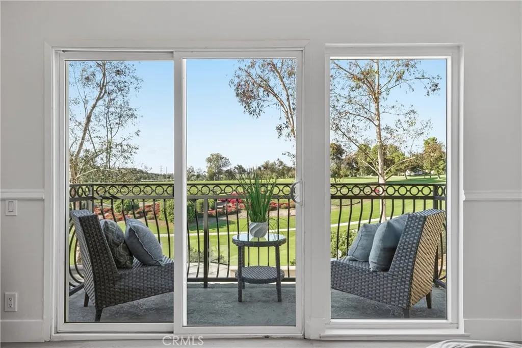 Primary Bedroom Balcony over looking the backyard and golfcourse.