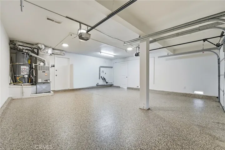 Garage has brand new epoxy flooring and hosts the HVAC, The water Heater and washer/dryer hook up