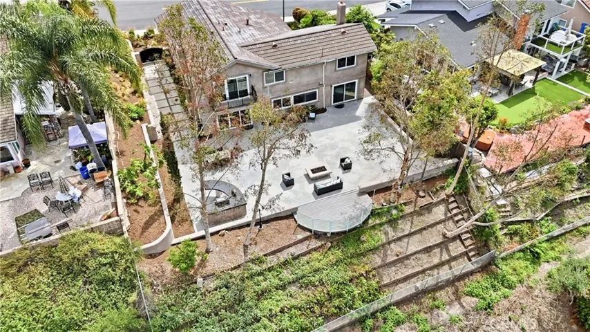 The lot ends at the last line of fence/wood. Plenty room for growing your organic vegetable garden